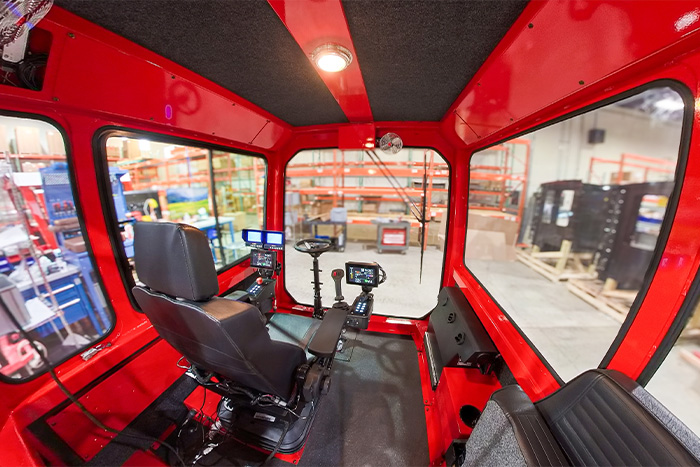 Interior of a multi-person operator cab designed for a railcar mover OEM